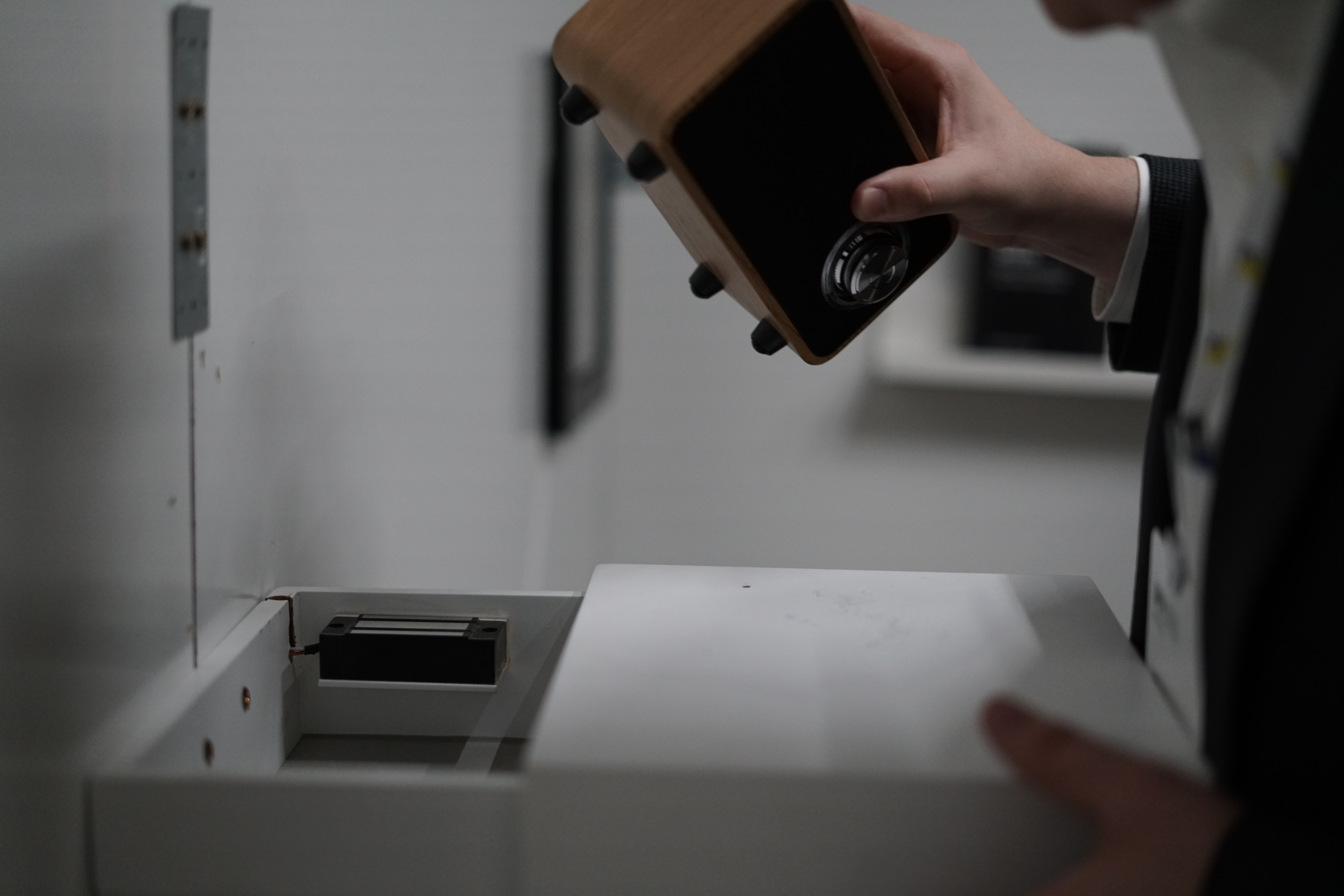 Unlocking a hidden "shelf" safe. I built it using a 70kg mag lock and a spring that popped the safe open once the mag lock was disengaged.